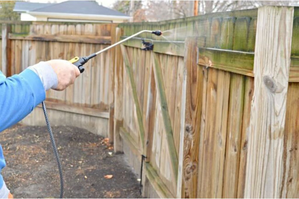 Freshly restored fence after professional cleaning